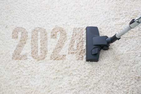 home cleaning with vacuum cleaner and copy space for a text, new year 2024の写真素材