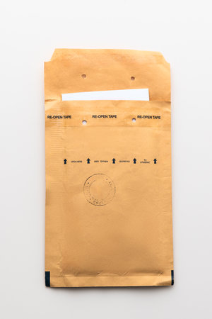 Padded envelope top view isolated on white background, cardboard bag, package paper letter.