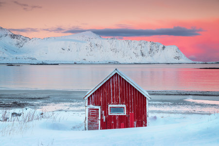 Ramberg Red Hut and nordic sea, Lofoten Islands, winter seascape Norway.の写真素材