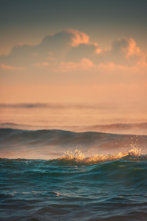 Golden Sunset Reflecting on Ocean Waves Under Vibrant Sky
