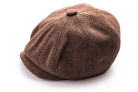 Vintage kids cap, classic retro eight-panel newsboy hat isolated on white backgroundの写真素材