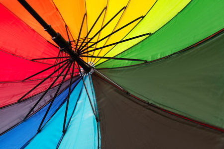 Multicolored umbrella isolated on a white background