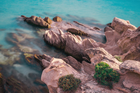 Crystal Turquoise  Blue Waters and Scenic Rocky Coastline in Greece Sea Island rocks in the water.