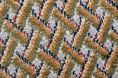 Carpet with simple patterns in white, black, mustard and orange colorsの写真素材