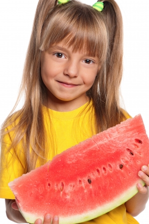 Little girl with slice of watermelon on white backgroundの写真素材