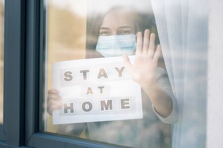 Concept of coronavirus quarantine. Child wearing medical protective face mask during flu virus,...