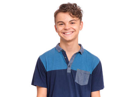 Handsome teen boy laughing looking very happy.
