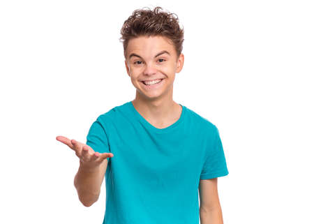 Handsome teen boy laughing looking very happy, isolated on white backgroundの写真素材