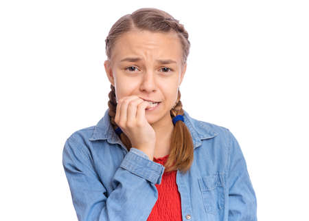 Emotional portrait of scared girl teenager, isolated on white backgroundの写真素材
