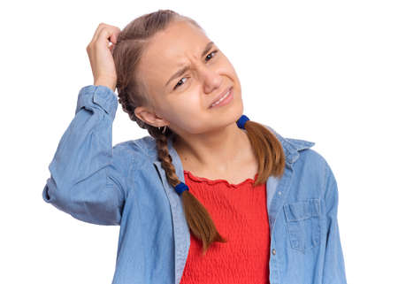 Emotional portrait of scared girl teenager looking with negative expression and disapproval, isolated on white backgroundの写真素材