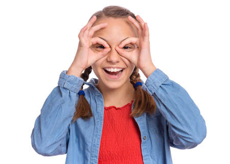 Happy teenage girl laughing looking very happy, isolated on white backgroundの写真素材