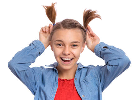 Happy teenage girl laughing looking very happy, isolated on white backgroundの写真素材