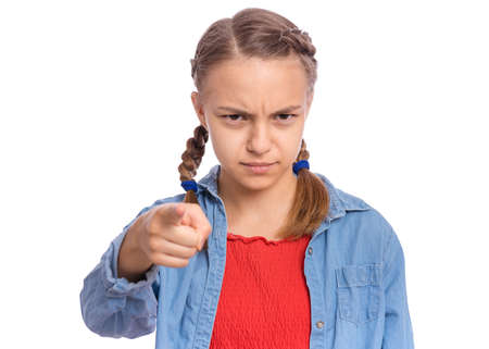 Emotional portrait of scared girl teenager looking with negative expression and disapproval, isolated on white backgroundの写真素材