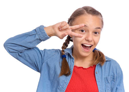 Happy teenage girl laughing looking very happy, isolated on white backgroundの写真素材
