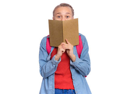 Beautiful teenage girl holds a exercise book in her hands, isolated on white background