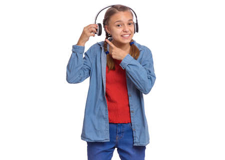 Beautiful teenage girl with headphones, isolated on white backgroundの写真素材