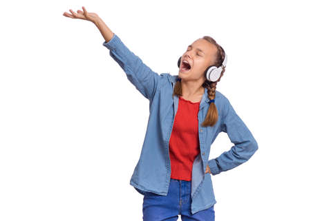 Beautiful teenage girl with headphones, isolated on white backgroundの写真素材
