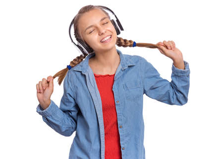 Beautiful teenage girl with headphones, isolated on white backgroundの写真素材