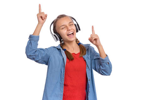Beautiful teenage girl with headphones, isolated on white backgroundの写真素材