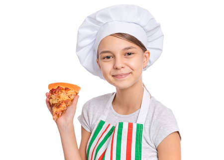Girl cook in apron holds plate with fresh pizza, isolated on white background.の写真素材
