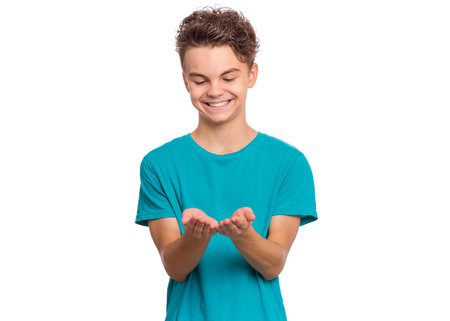 Handsome teen boy laughing looking very happy, isolated on white backgroundの写真素材