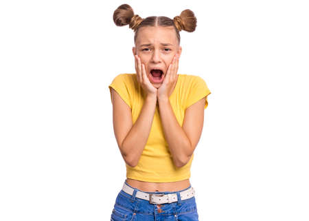 Emotional portrait of scared girl teenager, looking surprised with fear in her eyes. People and human expressions and emotions conceptの写真素材