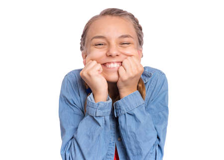 Happy teenage girl laughing looking very happy, isolated on white backgroundの写真素材