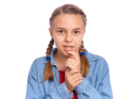 Emotional portrait of scared girl teenager, isolated on white backgroundの写真素材