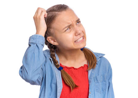 Emotional portrait of scared girl teenager looking with negative expression and disapproval, isolated on white backgroundの写真素材