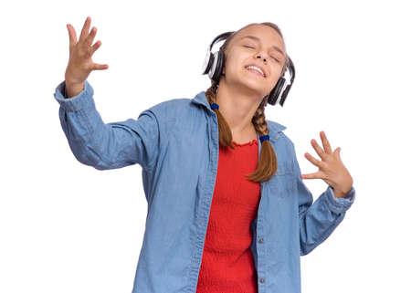 Beautiful teenage girl with headphones, isolated on white backgroundの写真素材