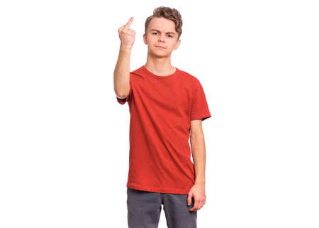 Portrait of angry teen boy showing middle fingers, isolated on white backgroundの写真素材
