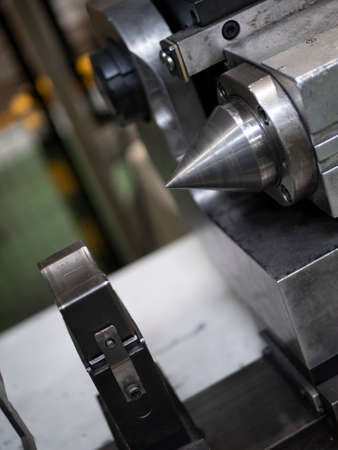 The tailstock of a lathe, close up. Processing of parts. Manufacturing equipmentの写真素材