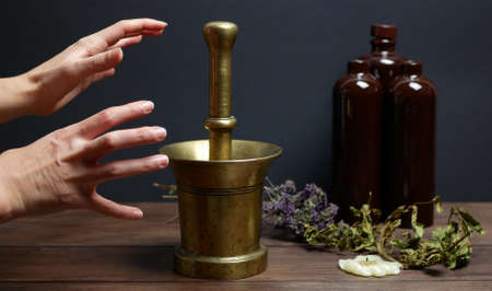 Practice the occult art of the alchemist or warlock. Process of the trituration of ingredients for...