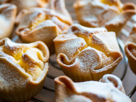 Sweet Ricotta pastries with funky shape, selective focus. Italian Soffioni Abruzzesi
