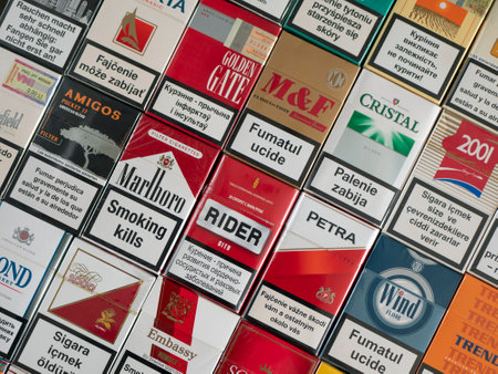 Soligorsk, Belarus - 5 September 2022: Cigarette packs with the calling to stop smoking in different languages. Smoking killsのeditorial素材