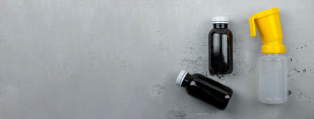 Teat dip cup for udder cow disinfection and solutions for dipping, banner. Disinfectant for veterinary use, selective focus. Ecological agricultureの写真素材