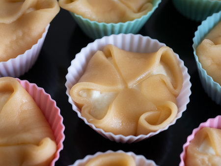 Pastry, showcasing the delicate folds and smooth texture, is ready before baking, selective focus....