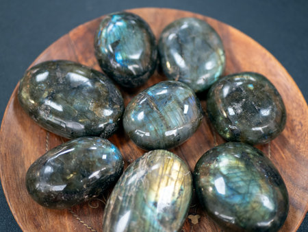Exquisite collection of labradorite stones showcasing their stunning iridescence, selective focus....