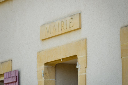 Town hall pediment of a small village, where the word "mairie" (town hall) is written on protruding Burgundy stone.の写真素材