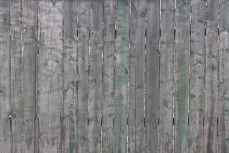old not painted fence from wooden planksの写真素材