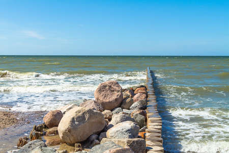 breakwater and granite stones on the Baltic sea.の写真素材
