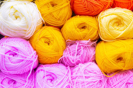 multi-colored bobbins of thread for knitting and Hobbies.