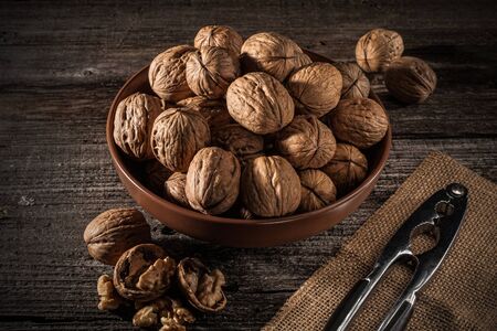 Walnuts in a bowl. Rustic style. Close up and horizontal orientation. の写真素材