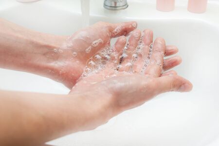 Washing hands with soap and water. Antibacterial protection and self-care. Stop the spread of...