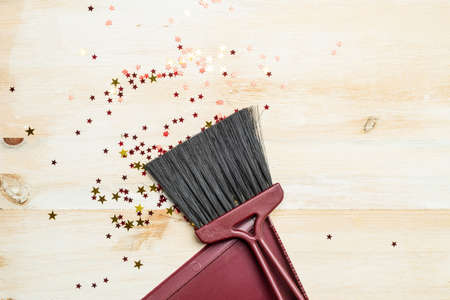Christmas background. Decorative ornaments of the red color of the star lie on a wooden eco-friendly...