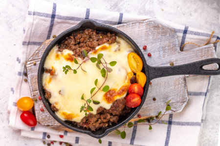 Moussaka. Traditional Greek dish. Chopped beef or lamb meat baked with eggplants, tomatoes and cheese.の写真素材