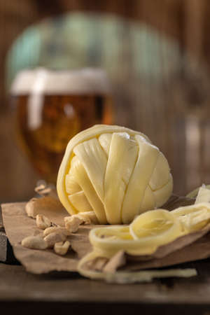 Oaxaca cheese. Traditional Mexican cheese made from cow's milk. Rustic style.
