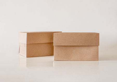 Blank Kraft Package Box Mock-up. Container, Packaging Template on light backgroundの写真素材