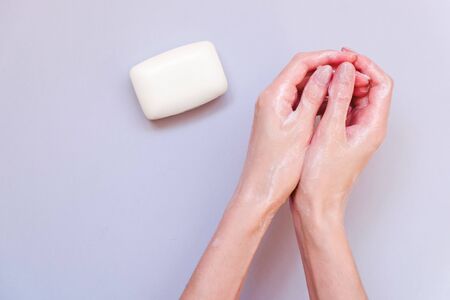 Washing hands using soap foam. A woman washes his hands with soap, antibacterial protectionの写真素材