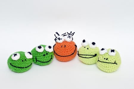 balls of wool dolls that look like frogsの写真素材